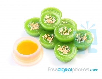 Green Multiple Scented Sesame Chinese Sweet And Liquid Sugar On White Floor Stock Photo