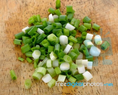 Green Onion On The Wooden Background Stock Photo