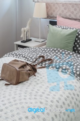 Green Pillow On Kid's Bedroom With Brown Bag Stock Photo