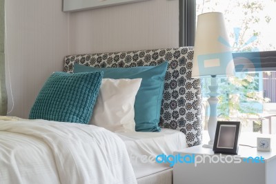 Green Pillows On Modern Bed With Modern White Lamp A Stock Photo