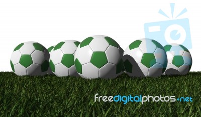 Green Soccer Balls On A Green Grass Stock Photo