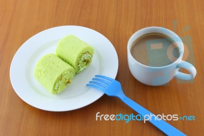 Green Sweet Roll Cake And Sweet Beverage On Breaking Time Stock Photo