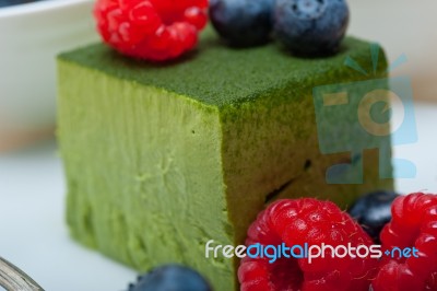 Green Tea Matcha Mousse Cake With Berries Stock Photo