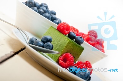 Green Tea Matcha Mousse Cake With Berries Stock Photo