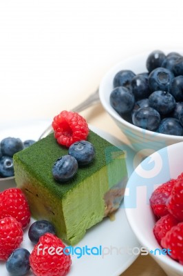 Green Tea Matcha Mousse Cake With Berries Stock Photo