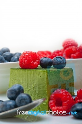 Green Tea Matcha Mousse Cake With Berries Stock Photo