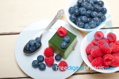 Green Tea Matcha Mousse Cake With Berries Stock Photo