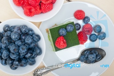 Green Tea Matcha Mousse Cake With Berries Stock Photo