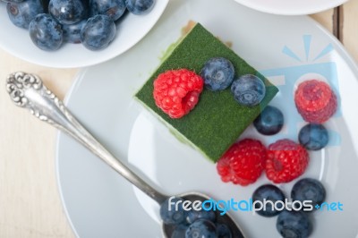 Green Tea Matcha Mousse Cake With Berries Stock Photo