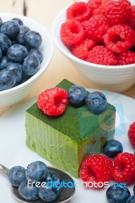 Green Tea Matcha Mousse Cake With Berries Stock Photo