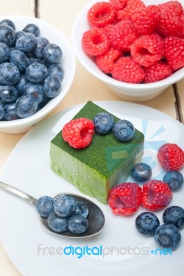 Green Tea Matcha Mousse Cake With Berries Stock Photo