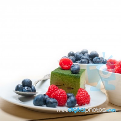 Green Tea Matcha Mousse Cake With Berries Stock Photo