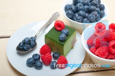 Green Tea Matcha Mousse Cake With Berries Stock Photo