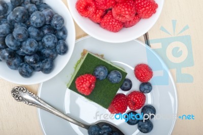 Green Tea Matcha Mousse Cake With Berries Stock Photo