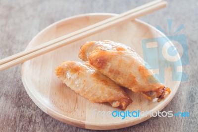 Grilled Chicken Wings On Wooden Plate Stock Photo