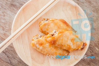 Grilled Chicken Wings On Wooden Plate Stock Photo