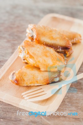 Grilled Chicken Wings On Wooden Plate Stock Photo