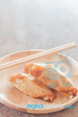 Grilled Chicken Wings On Wooden Plate Stock Photo