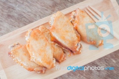 Grilled Chicken Wings On Wooden Plate Stock Photo