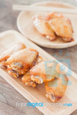 Grilled Chicken Wings On Wooden Plate Stock Photo