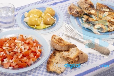 Grilled European Seabass With Potato And Tomato Salad Stock Photo