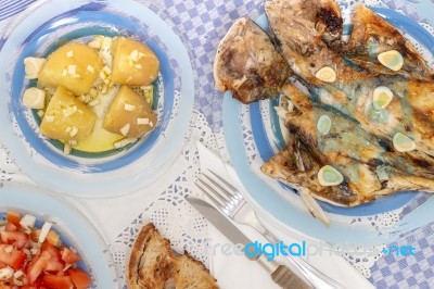 Grilled European Seabass With Potato And Tomato Salad Stock Photo