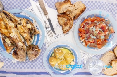 Grilled European Seabass With Potato And Tomato Salad Stock Photo