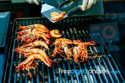 Grilled King Size Prawns On Fire Stock Photo