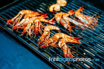 Grilled King Size Prawns On Fire Stock Photo