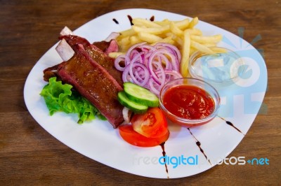 Grilled Meat With Potatoes Stock Photo