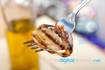 Grilled Onion On A Fork Stock Photo