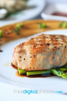 Grilled Pork Chop With Asparagus Stock Photo