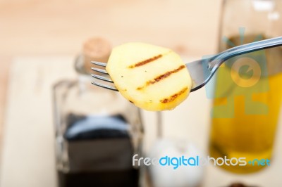 Grilled Potato On A Fork Stock Photo