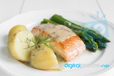 Grilled Salmon With Boiled Potatoes And Asparagus On White Plate… Stock Photo