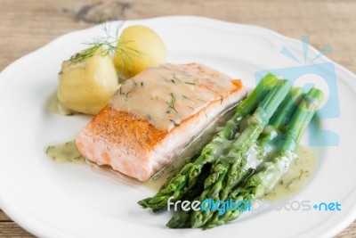 Grilled Salmon With Boiled Potatoes And Asparagus On White Plate… Stock Photo