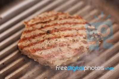 Grilled  Steak On Grill Pan Stock Photo