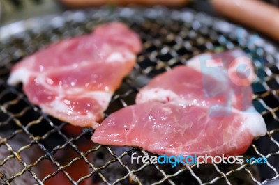 Grilling Pork On Grill Stock Photo