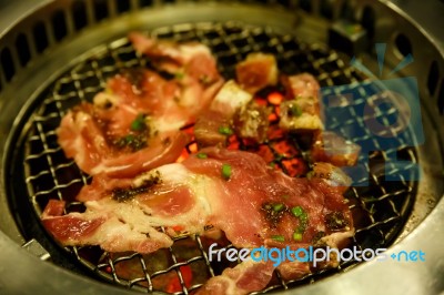 Grilling Pork On Grill Stock Photo