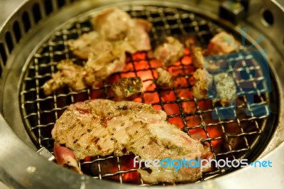 Grilling Pork On Grill Stock Photo