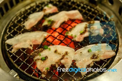 Grilling Pork On Grill Stock Photo