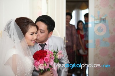 Groom Kissing To Bride Stock Photo