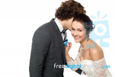 Groom Whispering Sweet Nothings Stock Photo