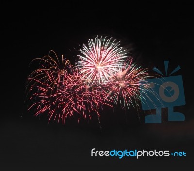 Group Firework Style Explode Line On Night Sky Stock Photo