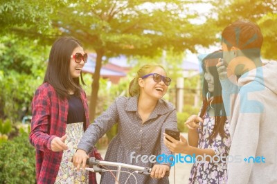 Group Of Asian Teenager Walking In The Park  Stock Photo