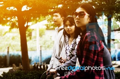 Group Of Asian Teenager Walking In The Park  Stock Photo