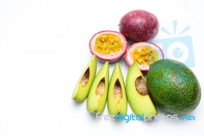 Group Of Avocados And Passion Fruit Isolated On A White Background Stock Photo