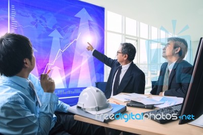 Group Of Business Man Meeting With Business Graph In Office Meeting Room Stock Photo