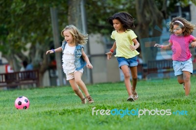 Group Of Childrens Having Fun In The Park Stock Photo