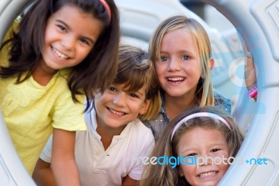 Group Of Childrens Having Fun In The Park Stock Photo