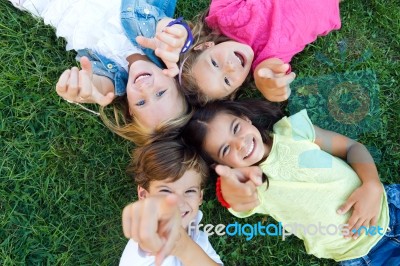 Group Of Childrens Having Fun In The Park Stock Photo